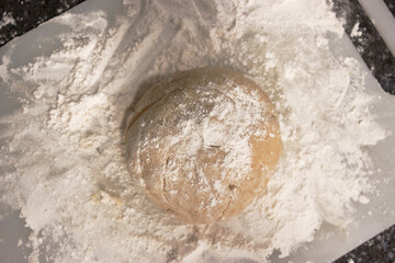 Dough with flour in a table
