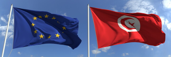 Flying flags of the European Union and Tunisia on sky background, 3d rendering