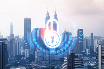 Padlock icon hologram over panorama city view of Kuala Lumpur to protect business, Malaysia, Asia. The concept of information security shields. Double exposure.