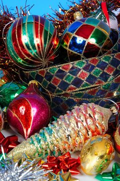 Glass Christmas baubles, bows and ribbon.