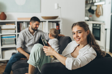 young happy family at home . woman using tablet computer