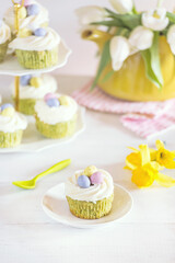 Green Easter cupcakes with colourful eggs