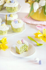 Green Easter cupcakes with colourful eggs