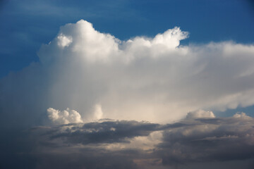 White yacht on sea surface and storm clouds