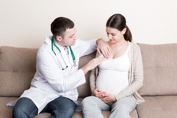 Doctor is checking pregnant woman's breast Health problems during pregnancy concept