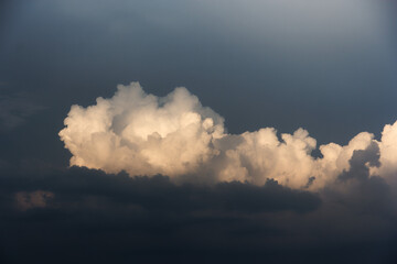 White yacht on sea surface and storm clouds