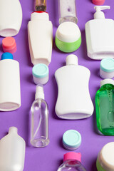 Group of plastic bodycare bottle Flat lay composition with cosmetic products on colored background empty space for you design. Set of White Cosmetic containers, top view with copy space