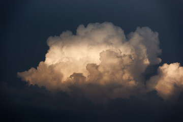 White yacht on sea surface and storm clouds