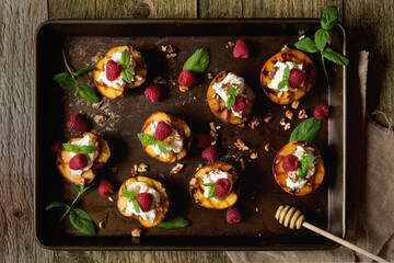 Dark mood grilled summer peaches with cream, raspberries & honey