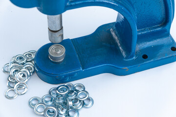 Close up hand press eyelet machine and eyelets details