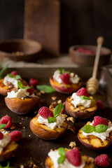 Dark mood grilled summer peaches with cream, raspberries & honey