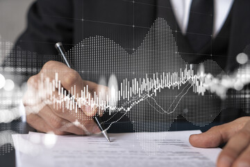 Businessman in suit signs contract. Double exposure with forex graph hologram. Man signing brokerage agreement. Financial market analysis and investment concept.