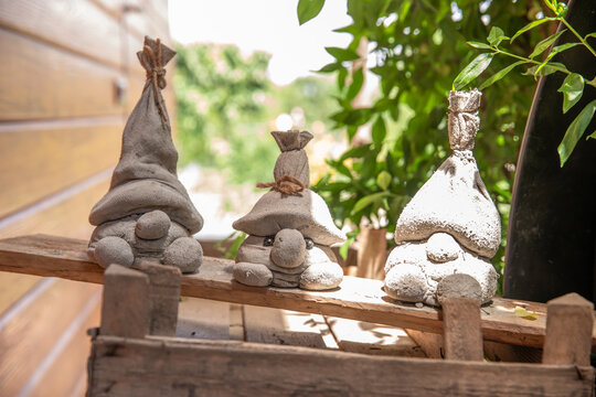 gnome with his own hands. dwarves and garden figures made of clay.