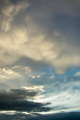 Obraz premium Stormy sky with fluffy clouds, abstract background, vertical