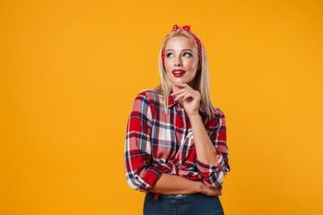 Image of pleased blonde pinup girl posing and looking aside