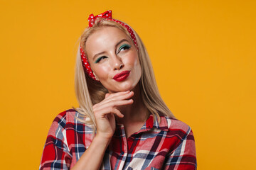 Image of pleased blonde pinup girl thinking and looking upward