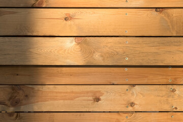 Fototapeta premium The background cladding is made of light wood planks.