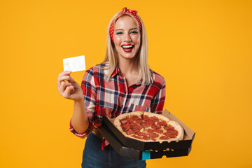 Image of happy charming pinup girl posing with credit card and pizza