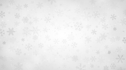 Christmas background of snowflakes of different shapes, sizes and transparency in gray and white colors