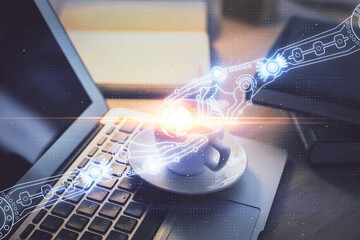 Double exposure of desktop computer and technology theme hologram. Concept of software development.