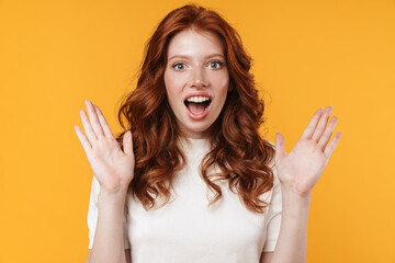 Image of ginger excited girl expressing surprise on camera