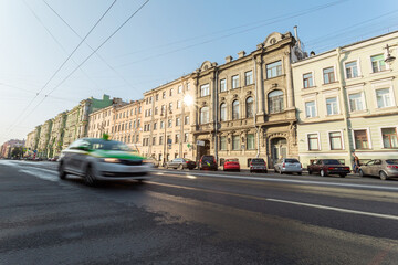 Saint Petersburg, Russia and one of the main streets with a taxi moving along on a sunny day of early autumn.