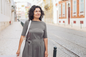A young pretty woman walking on the streets of Lisbon