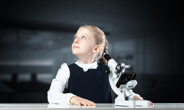 Little Girl Scientist With Microscope