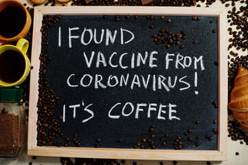 Fototapeta premium I found vaccine from Coronavirus it is coffee. Words on blackboard flat lay.