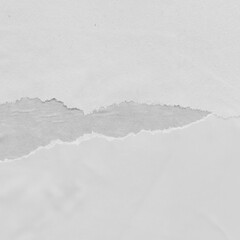 White torn paper collage close-up. Texture made from various paper and cardboard parts. Damaged old paper background. Vintage blank wallpaper. Material design backdrop.