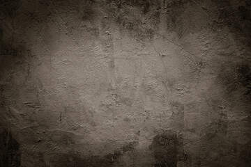 Grunge scratched brown/sepia/grey wall texture background.