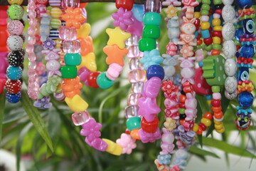 bead bracelets hanging on natural branch