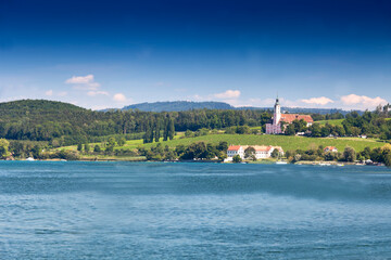 Fototapeta premium View over Lake Constance, ,near Uhldingen on the horizon the Pilgrimage church Birnau , Lake Constance, Baden-Württemberg, Germany, Europe