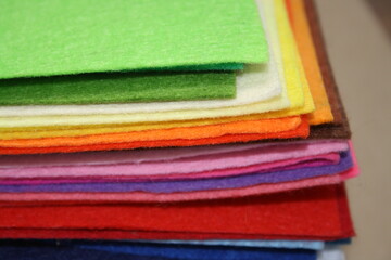 Fan of colored bright felt textile material