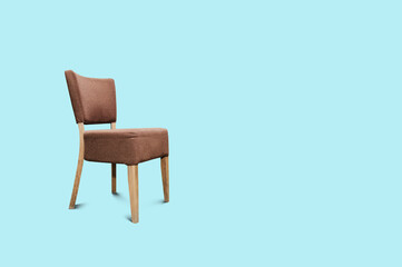 Retro chair on a blue pastel background. Utilities concept, empty chair on concrete.