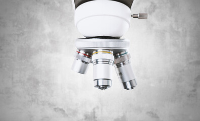 Using a biological microscope. Close-up of the microscope lens. Scientific research concept, using...