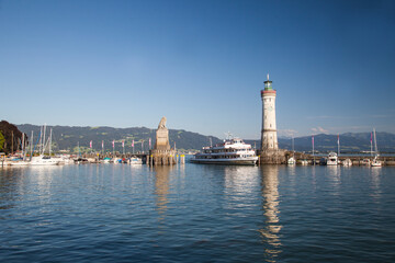 Fototapeta premium New Lindau lighthouse and Bavarian lion at the harbour entrance, harbour, Lindau island, Lindau on Lake Constance, Lake Constance region, Swabia, Germany, Europe