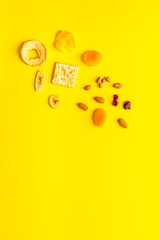 Healthy snacks overhead - nuts and dried fruits with crackers