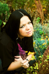 Young pretty woman in autumn park