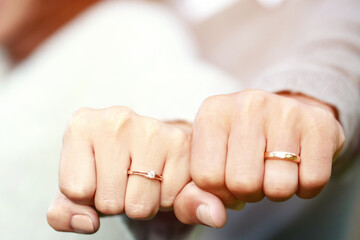 married wed couple holds hands and shows off her wedding rings. lover valentine day concept.