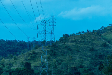 Obraz premium High voltage tower lines in the mountains
