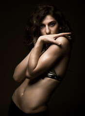 Fototapeta premium young woman dance on black background