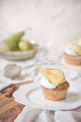 Bright pear cupcakes with frosting