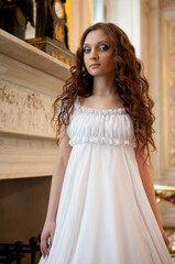 Naklejka premium Portrait of a beautiful young victorian lady in white dress