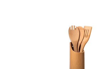 Close up kitchen utensils set isolated on white background. Wooden spoons, spatulas in holder. Cooking workshop, kitchenware, advertising in food industry, menus, brochures for restaurants concept