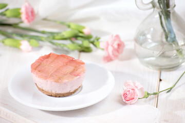 Mini pink rhubarb desserts and flowers