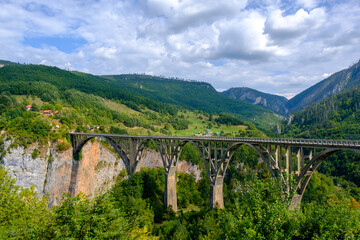 Fototapeta na wymiar Durdevica Tara arc bridge in the mountains, Montenegro