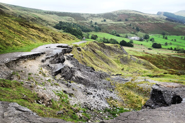 Fototapeta na wymiar Broken Road, the old A625 on the lows slopes of Mam Tor, Castleton, Derbyshire, UK