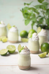 Obraz na płótnie Canvas Summer green lime desserts in jars