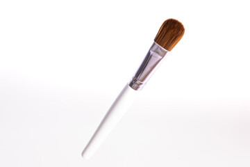 one makeup brush for powder and blusher isolated on white background copy space. Makeup accessories. Beauty cosmetic makeup product layout. Fashion woman make up brush
